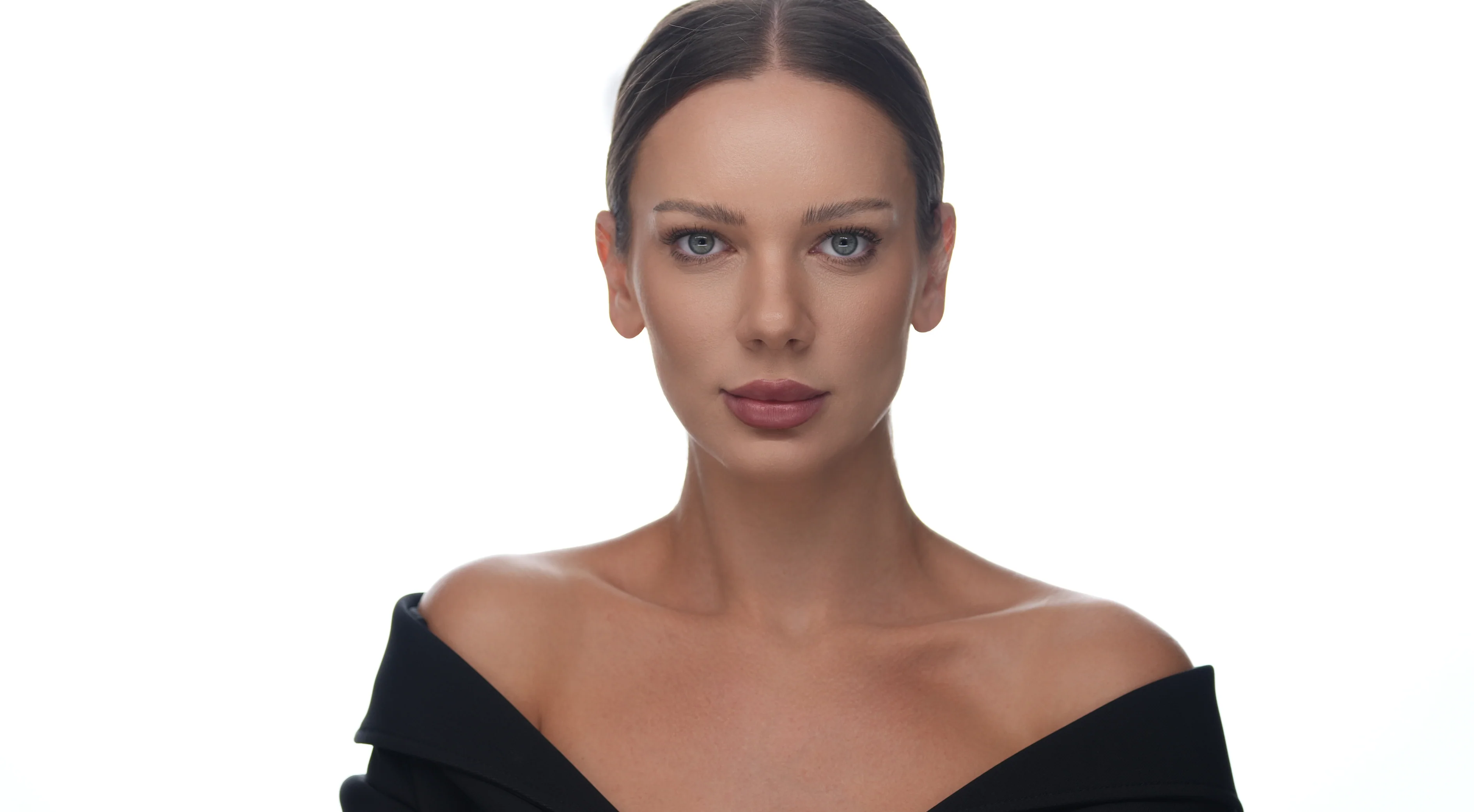 Roxana Diaconu in a black top worn off the shoulders.