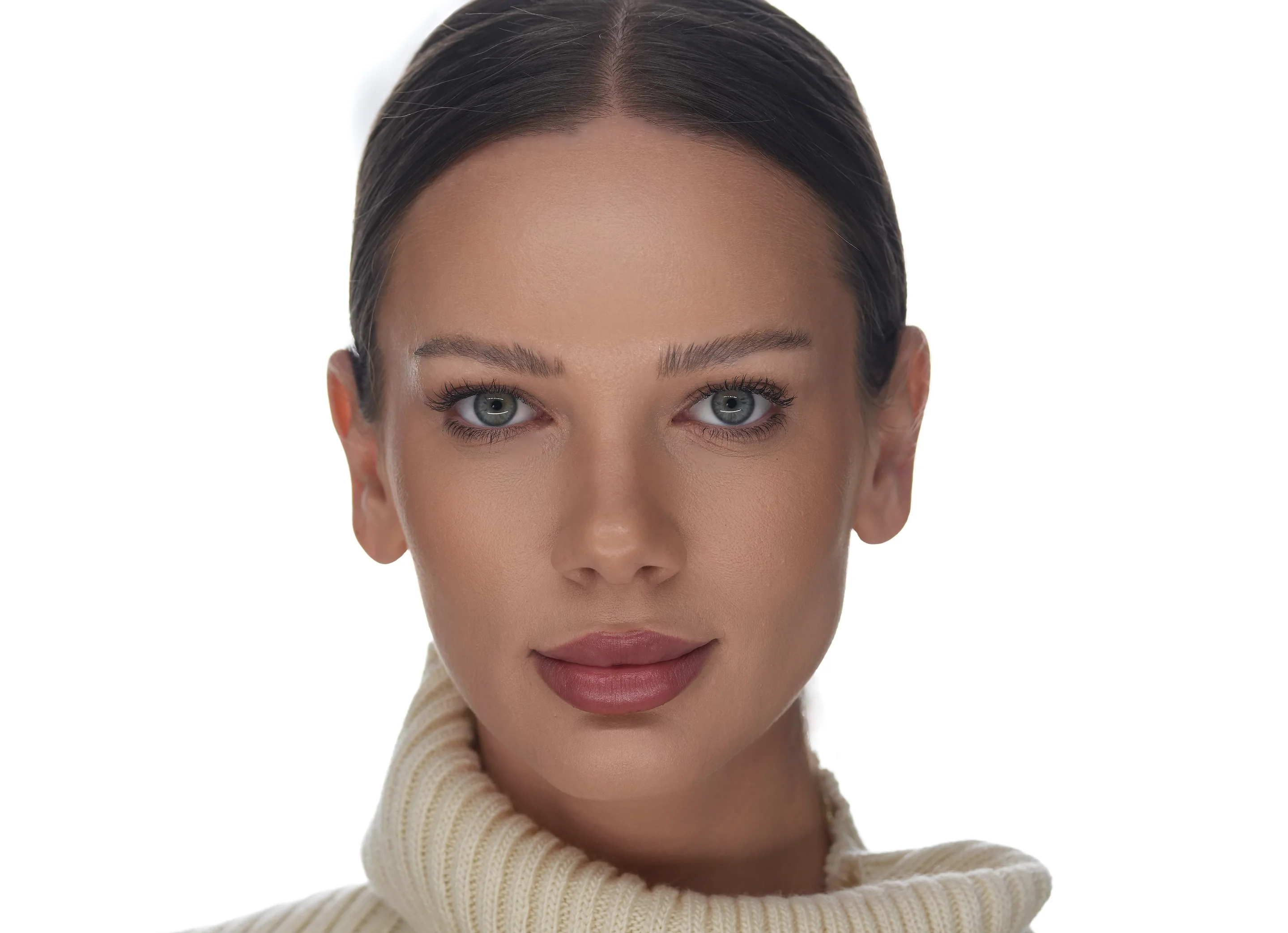 Roxana Diaconu in a cream knit, her hair drawn back.